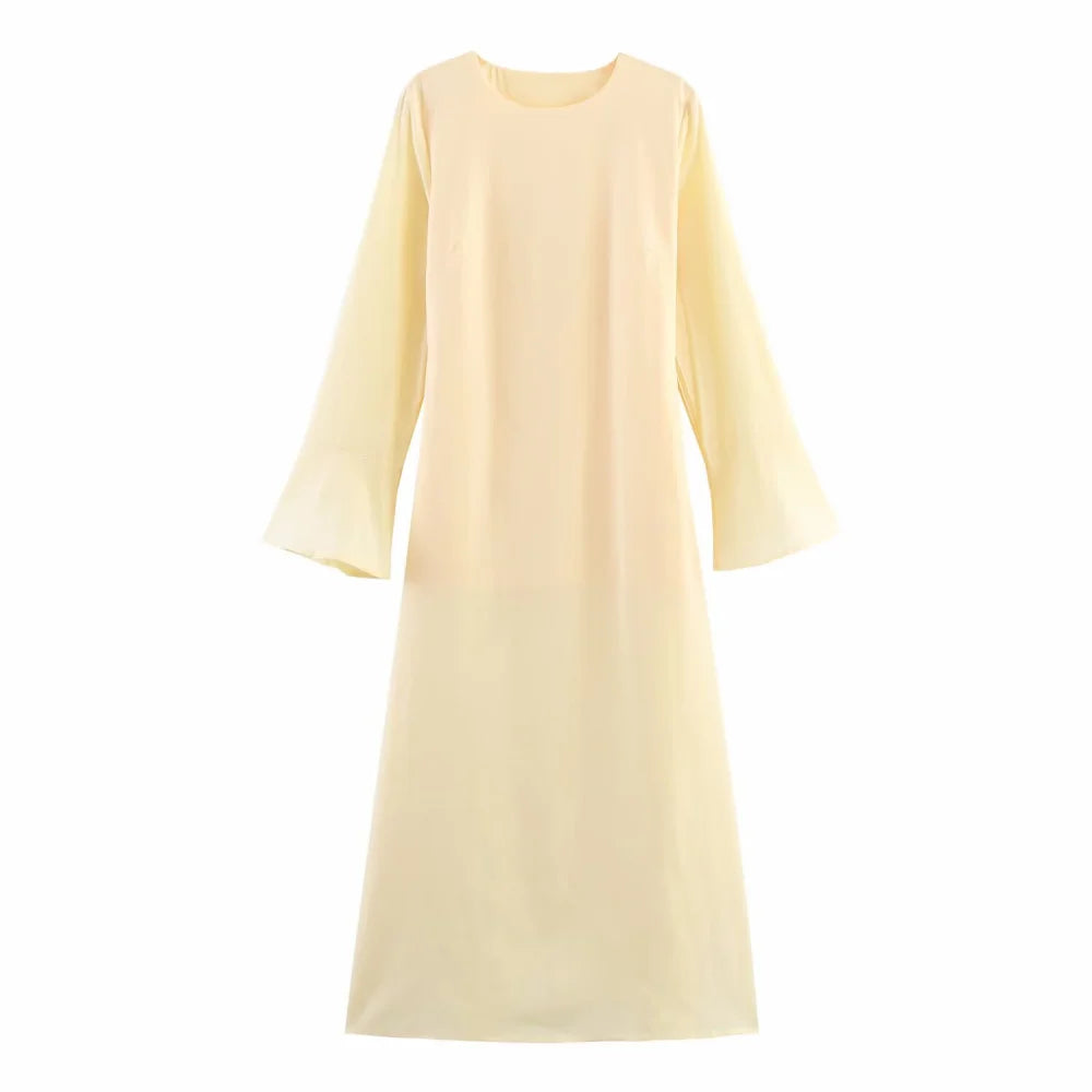 Light yellow dress with long sleeves on a white background