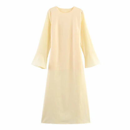 Light yellow dress with long sleeves on a white background